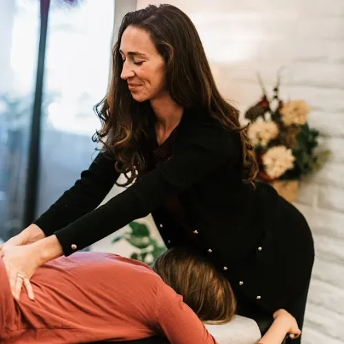 Chiropractor providing chiropractic treatment to a patient at The Alignment Studio.